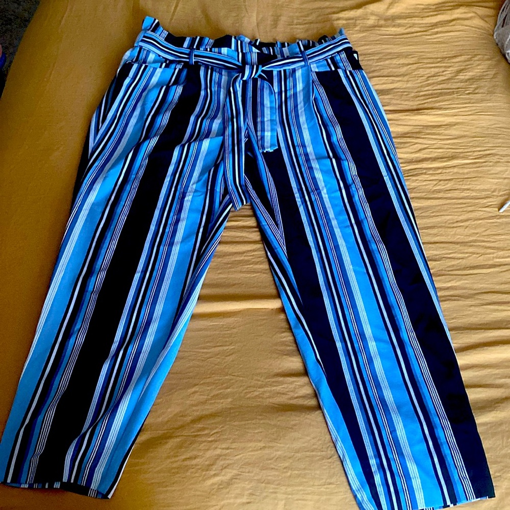 Still new! Business casual navy blue stripped pant with a tie belt.